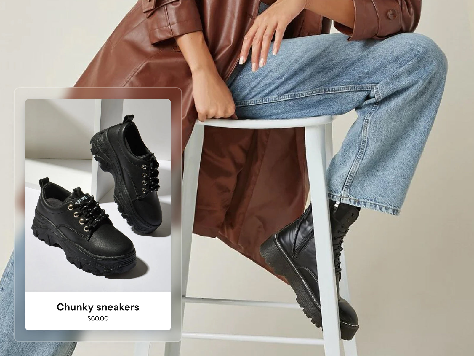 Screenshot of Flex Shopify theme by Out of the Sandbox. Background image of woman weather brown leather jacket, blue jeans, and black boots sitting on a white stool. In front, screenshot of black chunky sneakers.